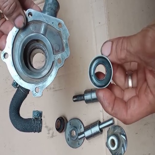 How do I remove the old water pump bearing?