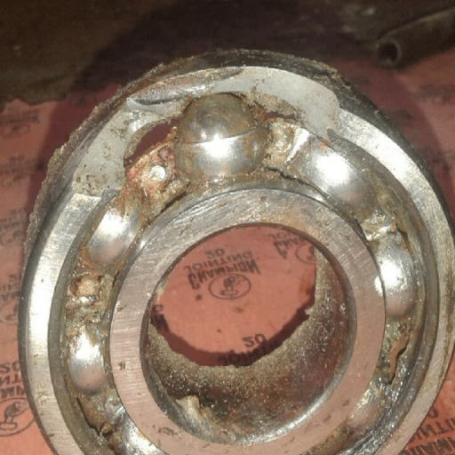 What are the signs of a failing water pump bearing?